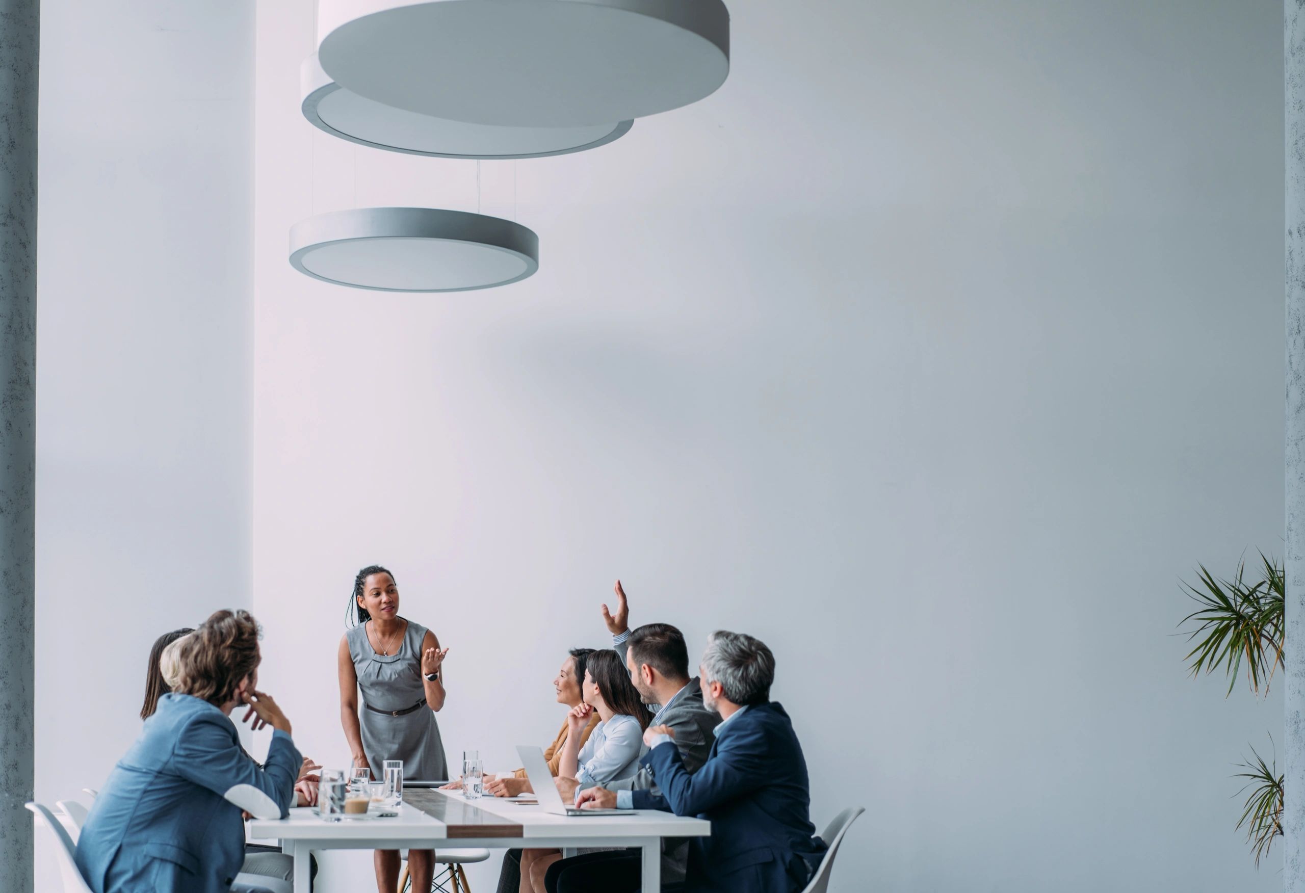 Advisor presenting to colleagues in a boardroom