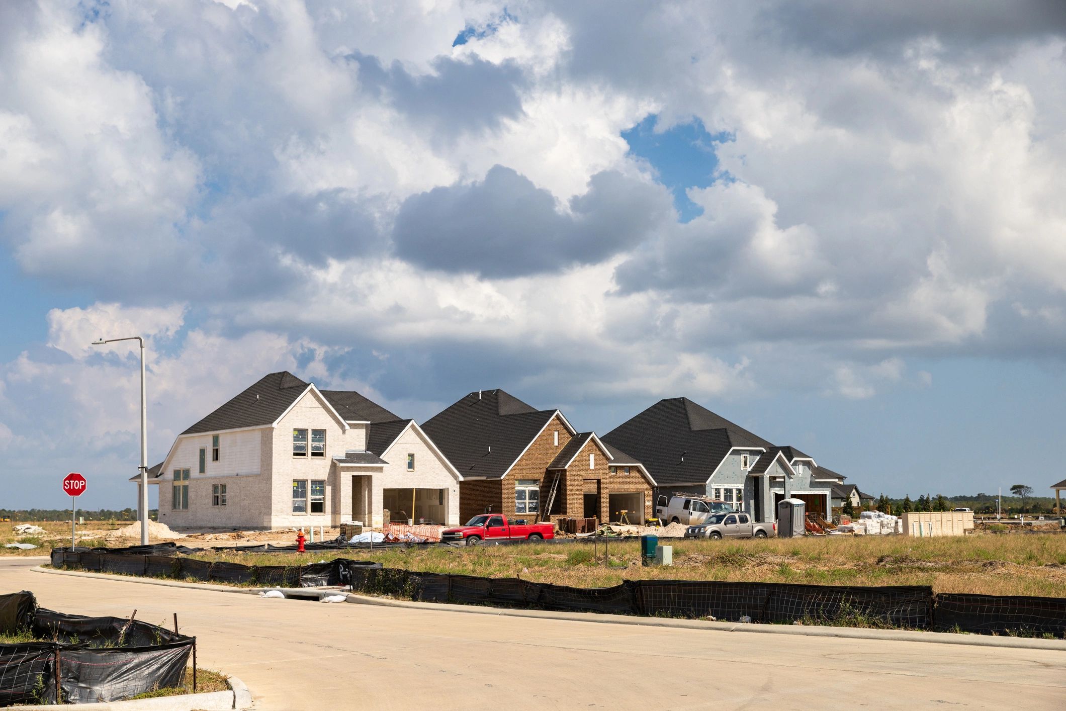 Row of homes under construction in a new residential development